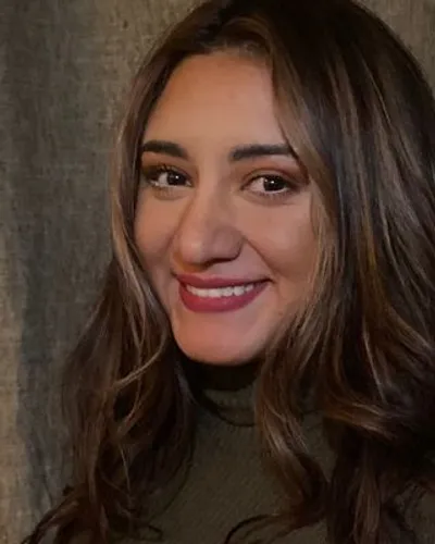 Diana Tabares-Avila smiling against a neutral background